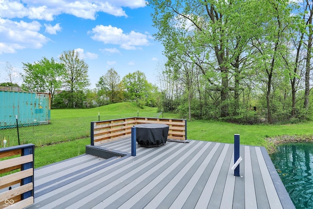 wooden deck with a lawn