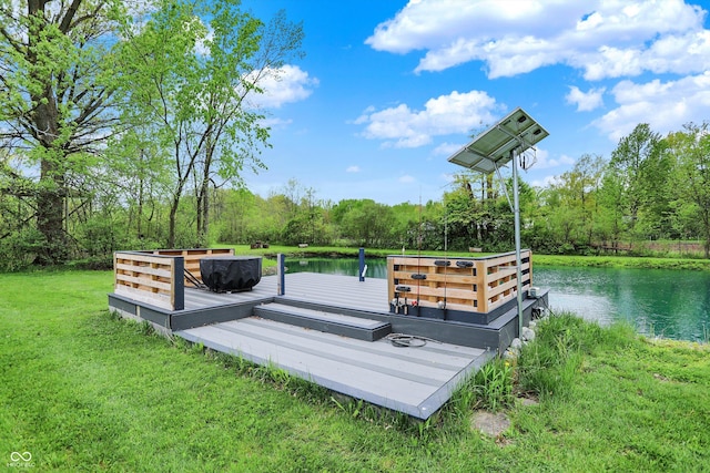 view of storm shelter featuring a water view and a lawn