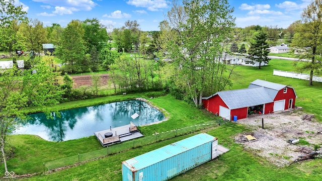 view of subject property with a large body of water and a tree filled landscape