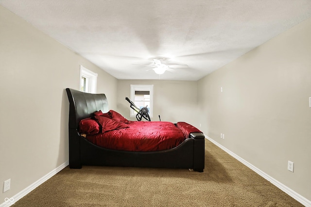 bedroom with carpet, baseboards, and ceiling fan