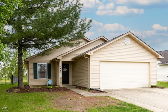 ranch-style house featuring concrete driveway, a garage, and fence