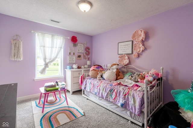 carpeted bedroom with visible vents and a textured ceiling