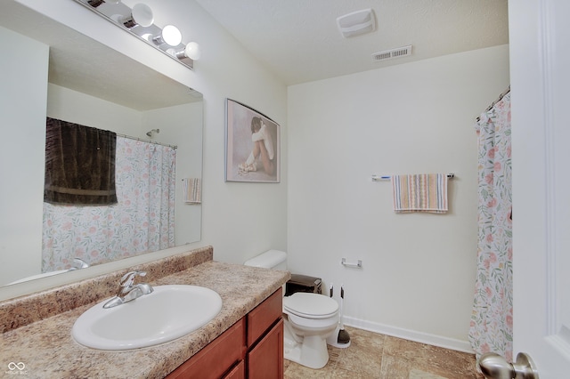7303 Beal Ln, Indianapolis, IN 46217 - bathroom with vanity, toilet, baseboards, and curtained shower