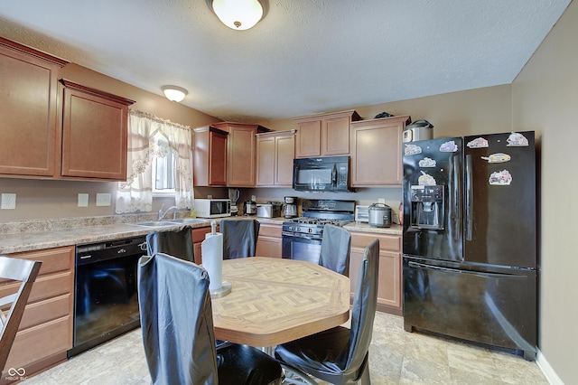 7303 Beal Ln, Indianapolis, IN 46217 - kitchen with black appliances, a sink, light countertops, and a textured ceiling