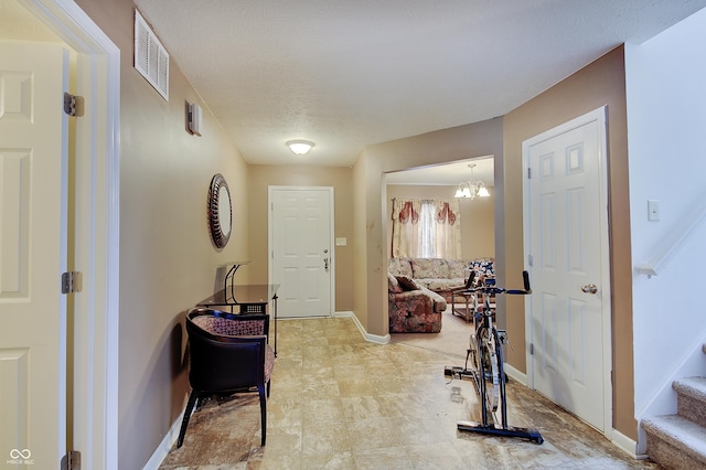 7303 Beal Ln, Indianapolis, IN 46217 - corridor featuring baseboards, stairway, and a chandelier