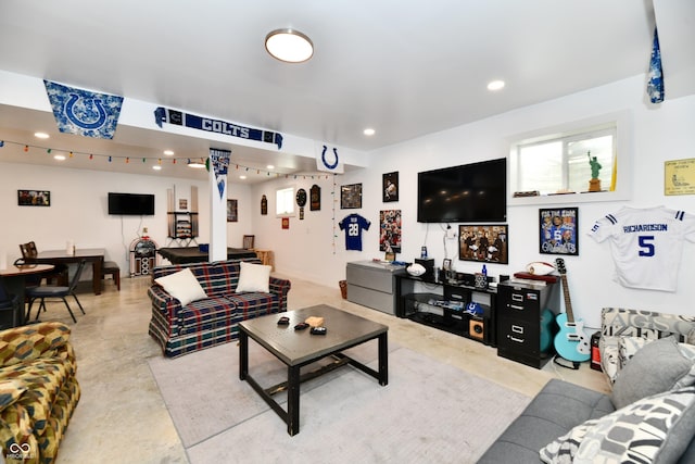 living room with recessed lighting and concrete floors