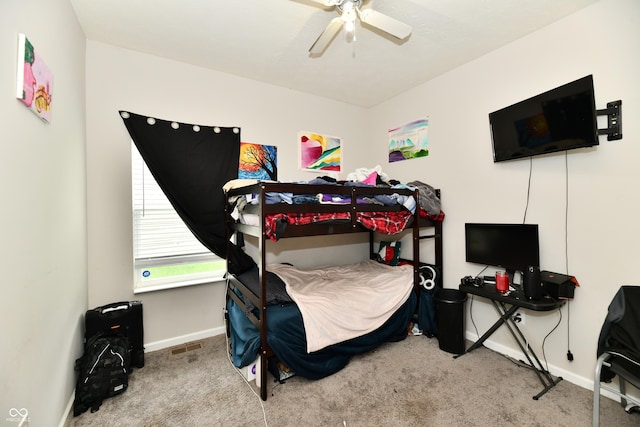 bedroom featuring baseboards, ceiling fan, and carpet