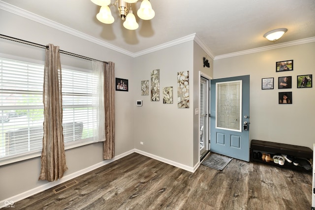 entrance foyer with crown molding, a chandelier, visible vents, and wood finished floors