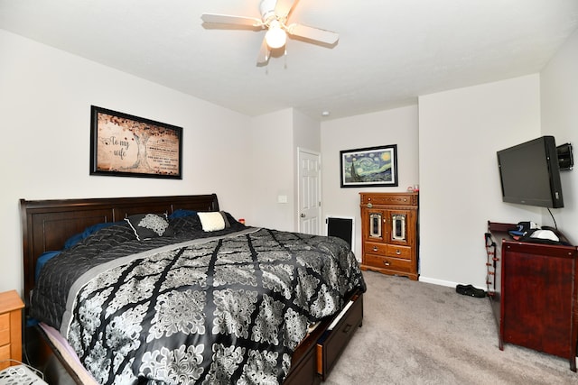 bedroom with baseboards, ceiling fan, and light carpet