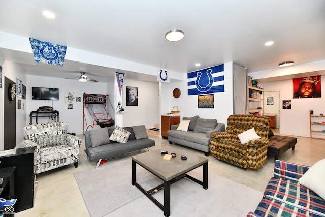 living room with recessed lighting, a ceiling fan, and finished concrete flooring