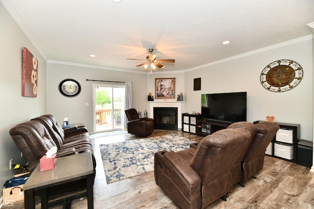 998 Cass Dr, Franklin, IN 46131 - living area featuring crown molding, ceiling fan, wood finished floors, and a fireplace