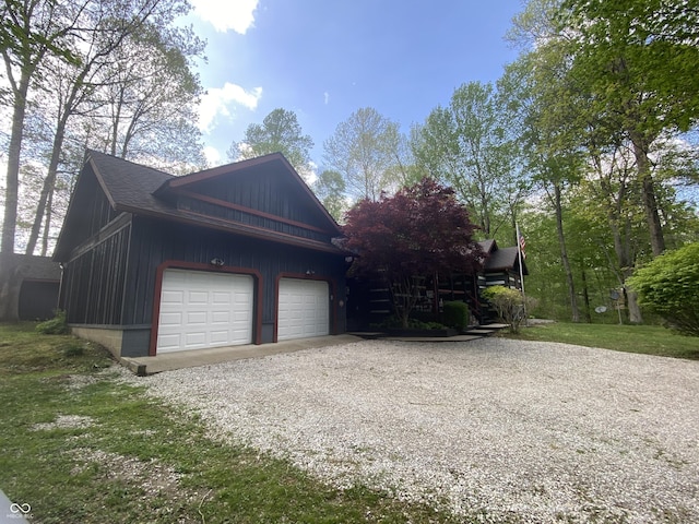 garage with gravel driveway