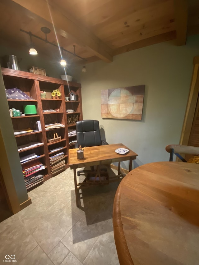 office space with beamed ceiling and rail lighting