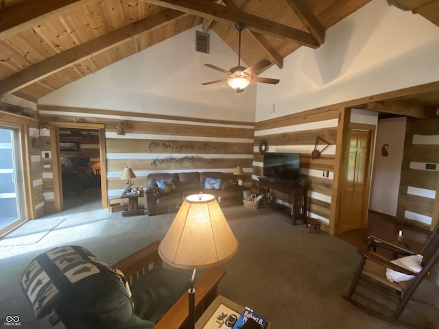 carpeted living area featuring wooden walls, ceiling fan, wooden ceiling, beamed ceiling, and visible vents