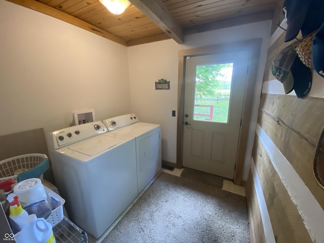 washroom featuring wooden ceiling, light carpet, laundry area, and washer and dryer