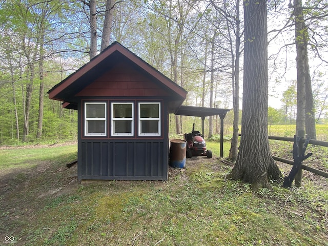 view of shed featuring an attached carport