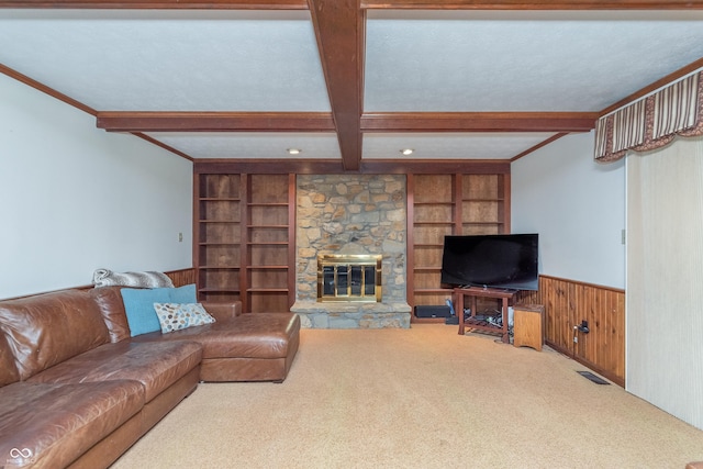 1421 Stoney Creek Cir, Carmel, IN 46032 - carpeted living area with beam ceiling, built in features, wainscoting, wood walls, and a stone fireplace