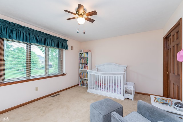1421 Stoney Creek Cir, Carmel, IN 46032 - carpeted bedroom featuring baseboards, ceiling fan, and a nursery area