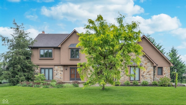 1421 Stoney Creek Cir, Carmel, IN 46032 - view of front of property with stone siding, a front lawn, and a chimney