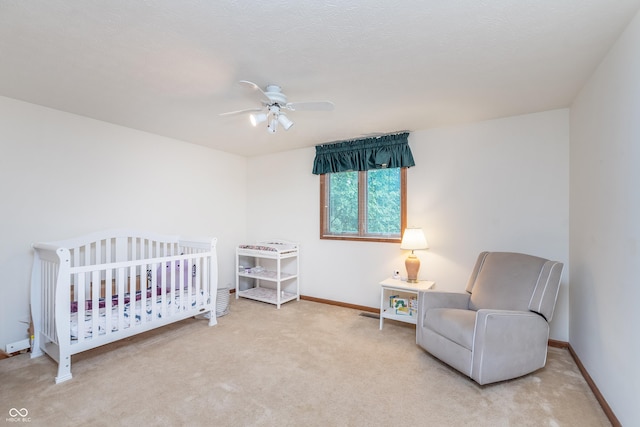 1421 Stoney Creek Cir, Carmel, IN 46032 - bedroom featuring carpet floors, a crib, baseboards, and ceiling fan