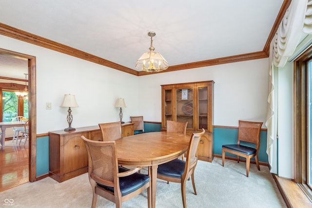 1421 Stoney Creek Cir, Carmel, IN 46032 - dining area featuring a chandelier, crown molding, and light carpet
