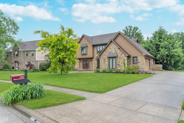 1421 Stoney Creek Cir, Carmel, IN 46032 - craftsman-style home with stone siding, a front lawn, concrete driveway, and an attached garage