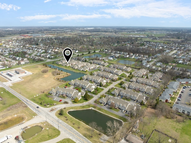 drone / aerial view featuring a water view and a residential view