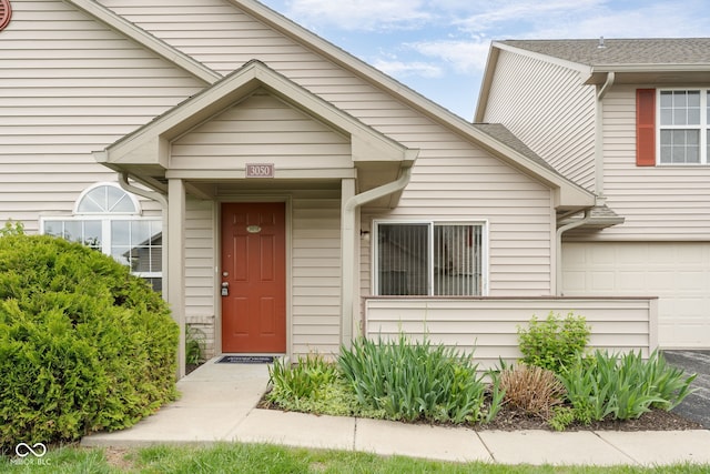 property entrance with an attached garage