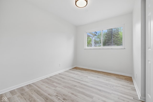 1116 Heatherwood Dr, Indianapolis, IN 46241 - empty room with light wood-style floors and baseboards