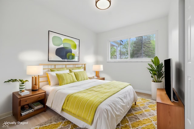1116 Heatherwood Dr, Indianapolis, IN 46241 - bedroom featuring baseboards and wood finished floors
