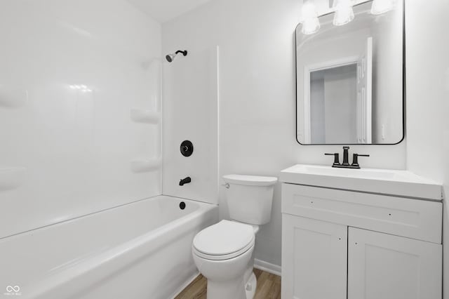 1116 Heatherwood Dr, Indianapolis, IN 46241 - full bath featuring bathtub / shower combination, wood finished floors, vanity, baseboards, and toilet