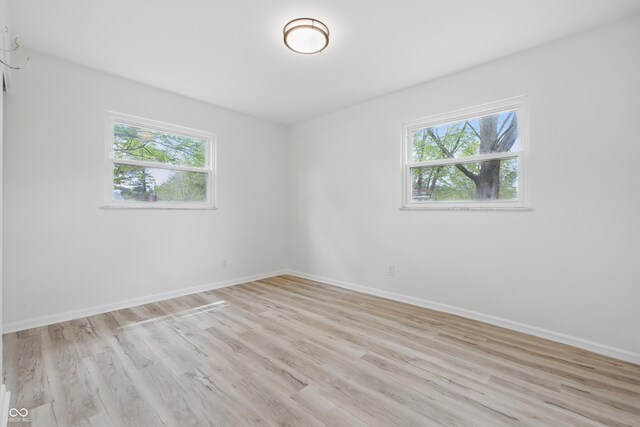 1116 Heatherwood Dr, Indianapolis, IN 46241 - spare room with baseboards and a healthy amount of sunlight
