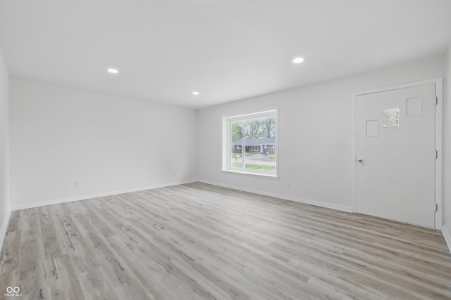 1116 Heatherwood Dr, Indianapolis, IN 46241 - unfurnished living room featuring recessed lighting, baseboards, and light wood-type flooring
