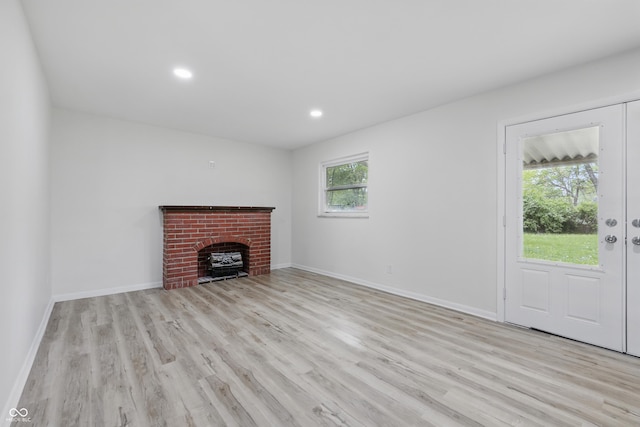 1116 Heatherwood Dr, Indianapolis, IN 46241 - unfurnished living room featuring recessed lighting, baseboards, a brick fireplace, and light wood finished floors