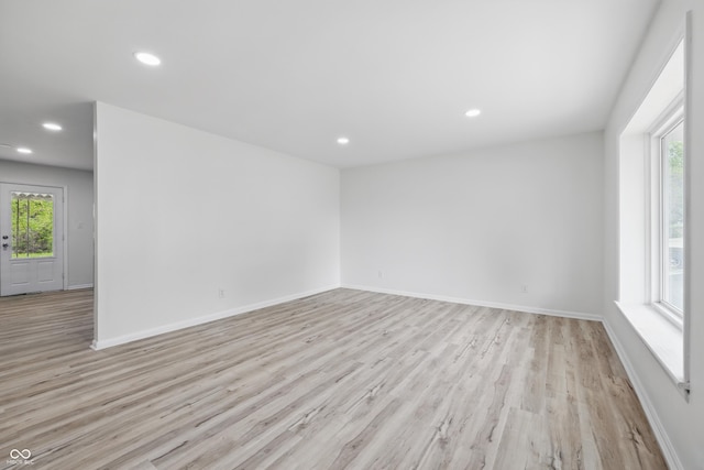 1116 Heatherwood Dr, Indianapolis, IN 46241 - unfurnished room featuring plenty of natural light, recessed lighting, light wood-style flooring, and baseboards