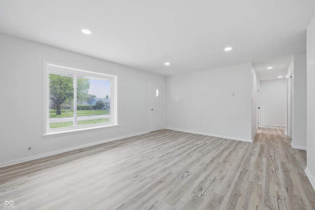 1116 Heatherwood Dr, Indianapolis, IN 46241 - unfurnished living room featuring recessed lighting, baseboards, and light wood-style flooring