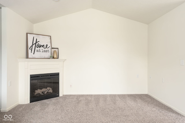 3006 Wildcat Ln, Indianapolis, IN 46203 - unfurnished living room featuring baseboards, carpet flooring, a fireplace, and vaulted ceiling