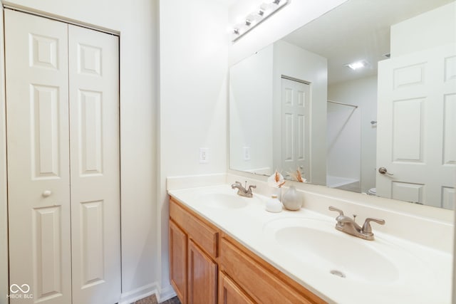 3006 Wildcat Ln, Indianapolis, IN 46203 - full bath with a closet, double vanity, and a sink