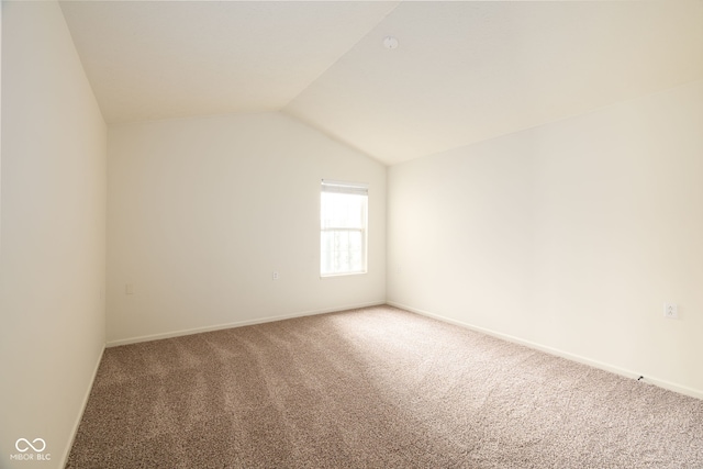 3006 Wildcat Ln, Indianapolis, IN 46203 - carpeted empty room with baseboards and vaulted ceiling