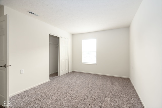 3006 Wildcat Ln, Indianapolis, IN 46203 - unfurnished bedroom with carpet, a closet, baseboards, and visible vents