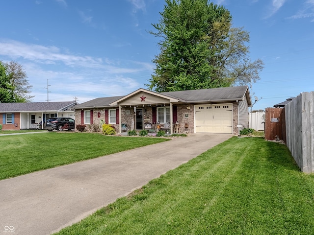 632 Woodside Ct, Seymour, IN 47274 - single story home with a garage, fence, covered porch, a front yard, and concrete driveway