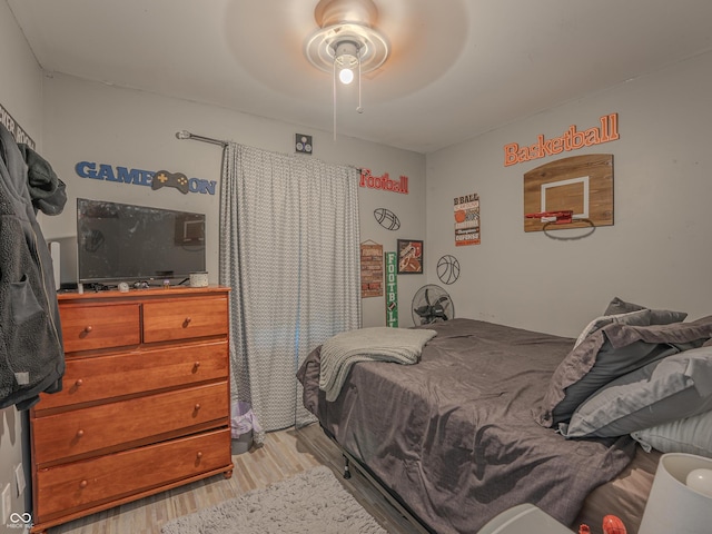 632 Woodside Ct, Seymour, IN 47274 - bedroom featuring a ceiling fan and light wood-type flooring