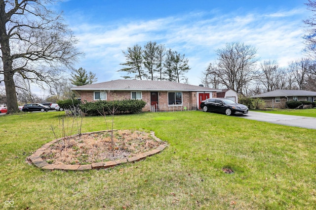 5027 E 40th St, Indianapolis, IN 46226 - ranch-style home featuring a front yard, driveway, and brick siding