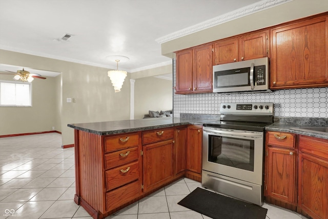 5027 E 40th St, Indianapolis, IN 46226 - kitchen featuring appliances with stainless steel finishes, decorative backsplash, dark countertops, a peninsula, and ornamental molding