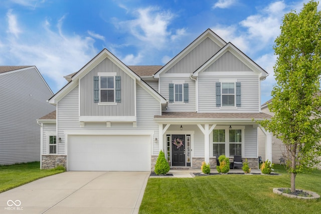 craftsman house with a front lawn, a garage, board and batten siding, covered porch, and driveway