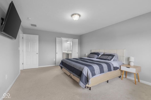 bedroom featuring visible vents, baseboards, and light colored carpet