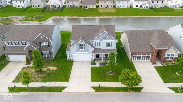 aerial view featuring a water view and a residential view