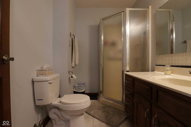 9903 E Raymond St, Indianapolis, IN 46239 - full bathroom with tile patterned flooring, decorative backsplash, a shower stall, and toilet
