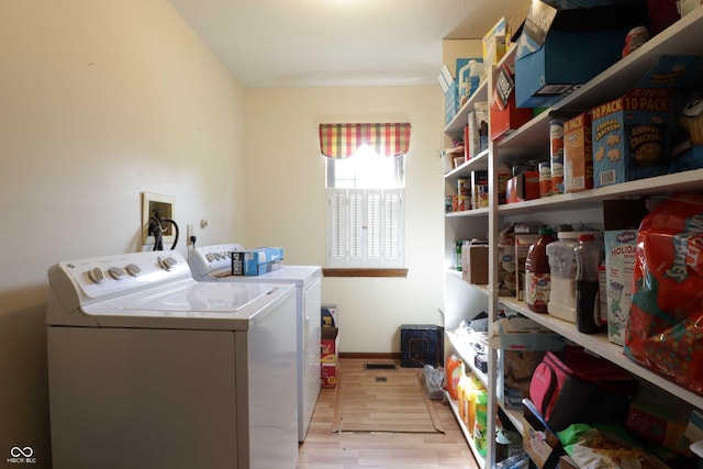 9903 E Raymond St, Indianapolis, IN 46239 - clothes washing area with laundry area, washer and clothes dryer, and light wood-style floors