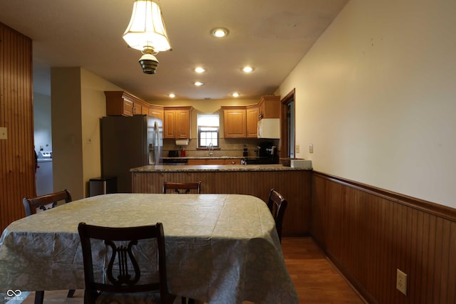 9903 E Raymond St, Indianapolis, IN 46239 - kitchen featuring stainless steel refrigerator with ice dispenser, wainscoting, wood finished floors, a sink, and recessed lighting